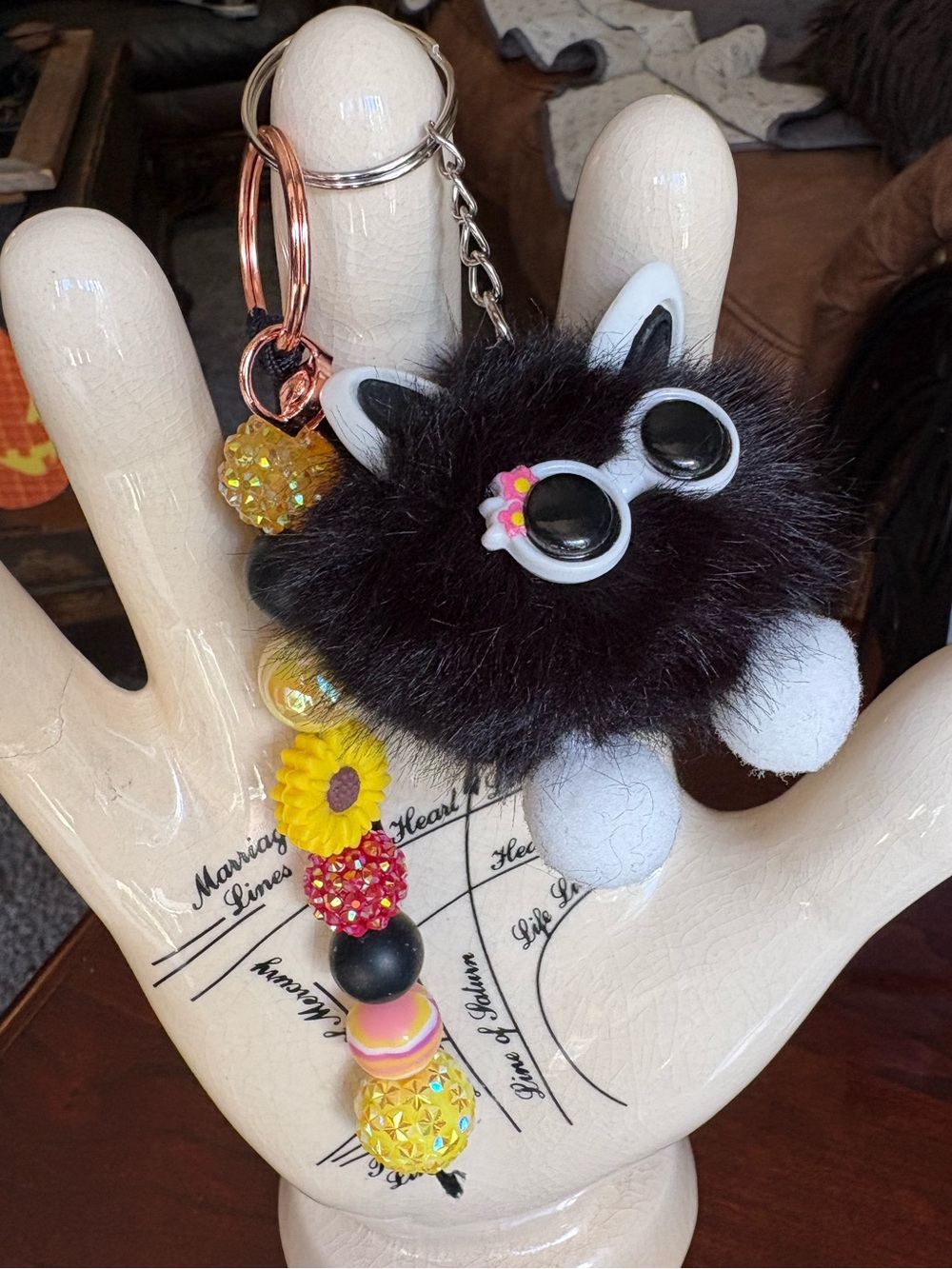 Plush Black Pom-Pom Kitty Keychain with Yellow sunflower Charm